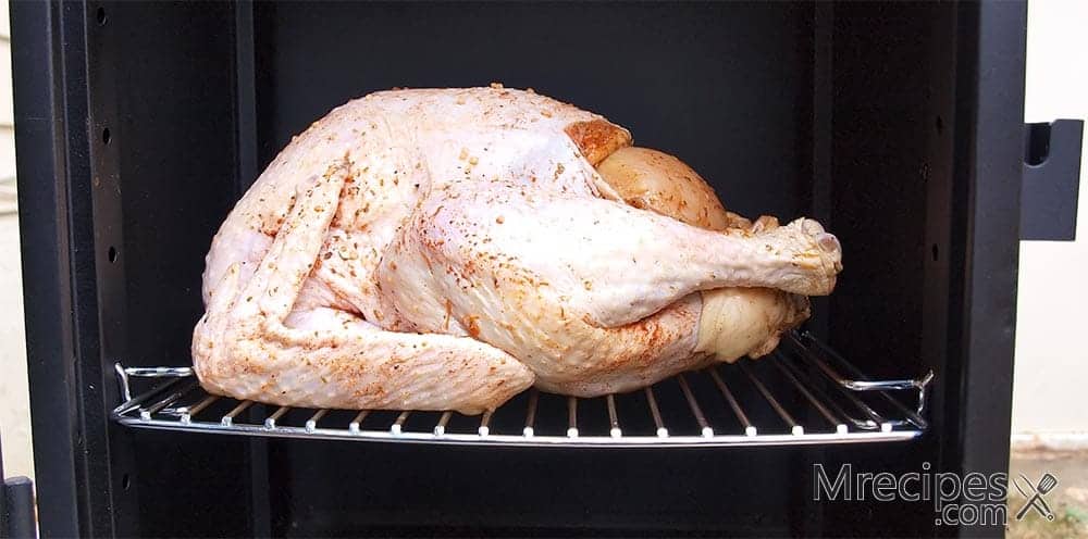 Whole Thanksgiving turkey in a smoker